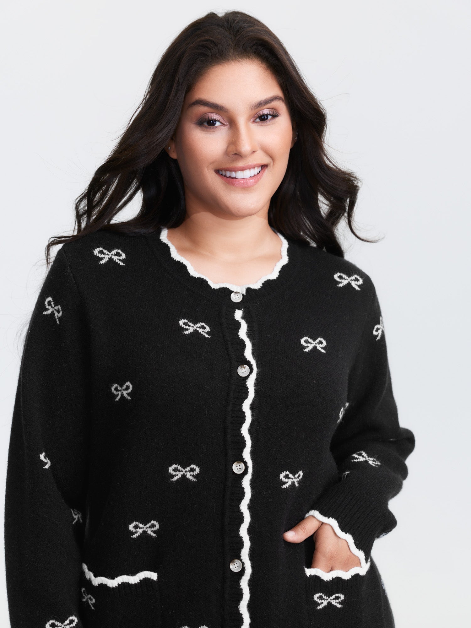 Bowknot Jacquard Wavy Edge Knit Cardigan